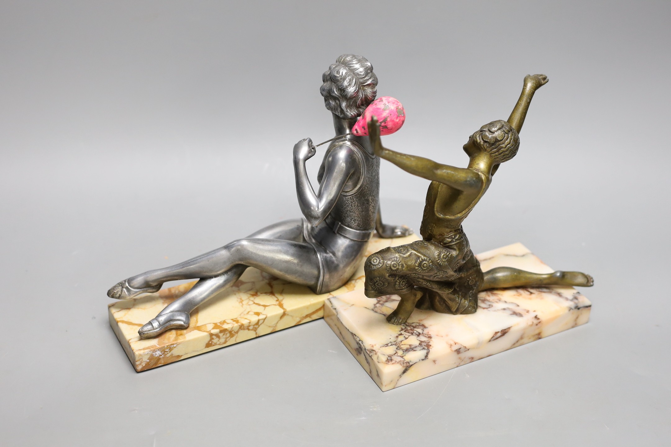 An Art Deco ‘bathing beauty’ metal figure on stand and another of a female dancer on marble stand, ‘bathing beauty’ 25cms wide